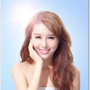 Beautiful woman face with sunshine and sky