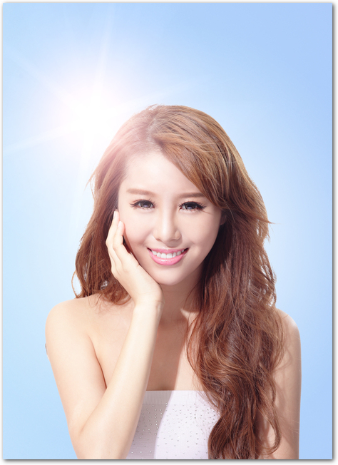 Beautiful woman face with sunshine and sky