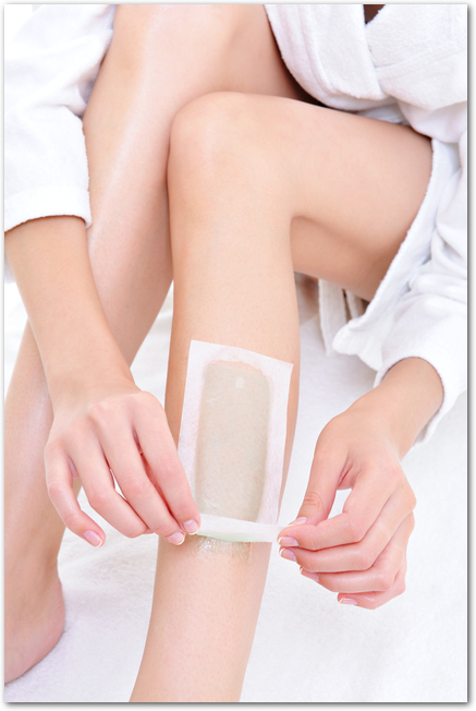 depilation on the female legs with waxing