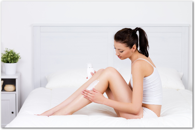 woman caring about her legs with lotion